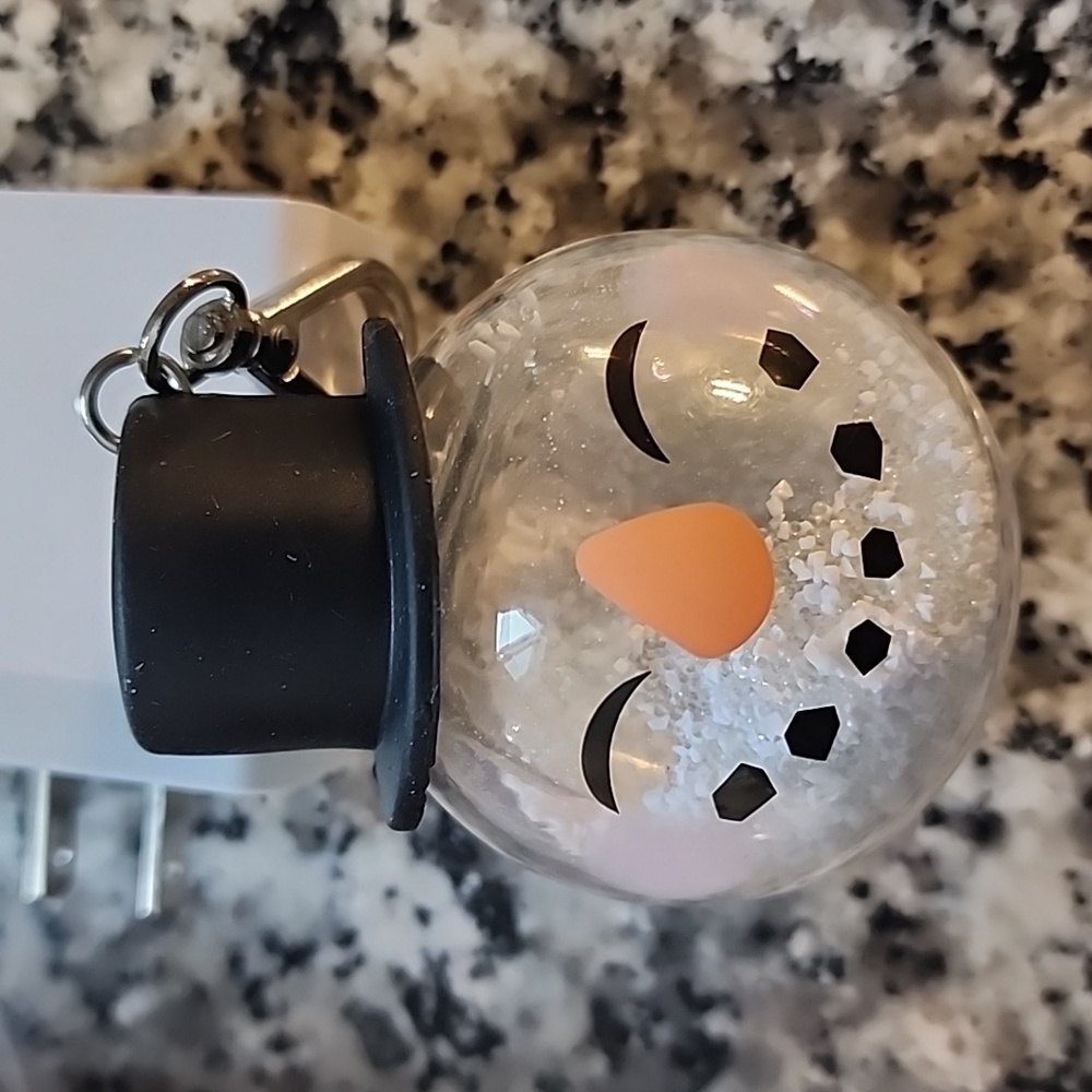 BBW Rare Christmas snow globe filled with "snow" snowman pocketbac holder